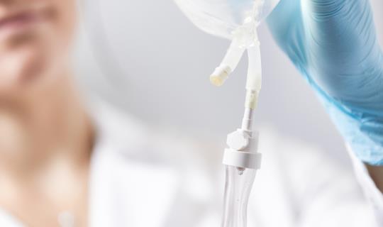 Nurse holding IV