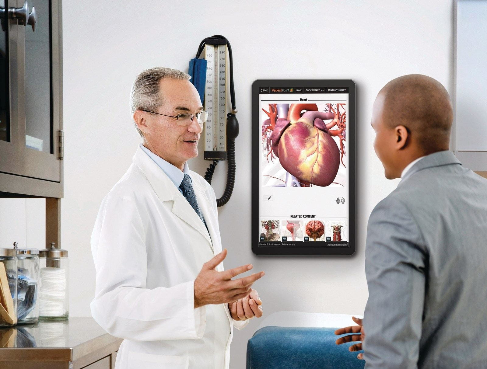 Doctor talking to a patient in an exam room